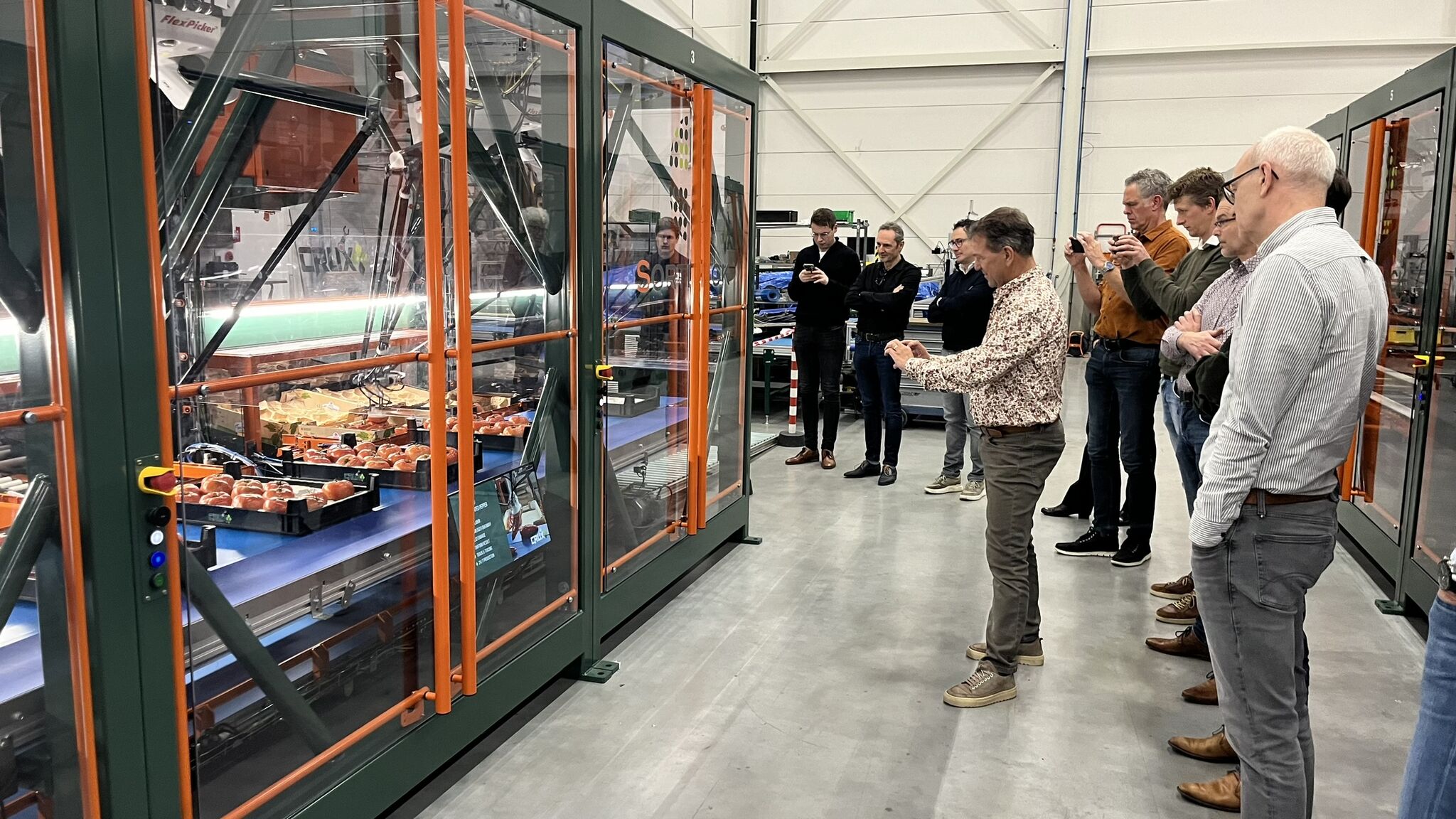 Working group of AVAG standing near the SortiPack at Crux Agribotics